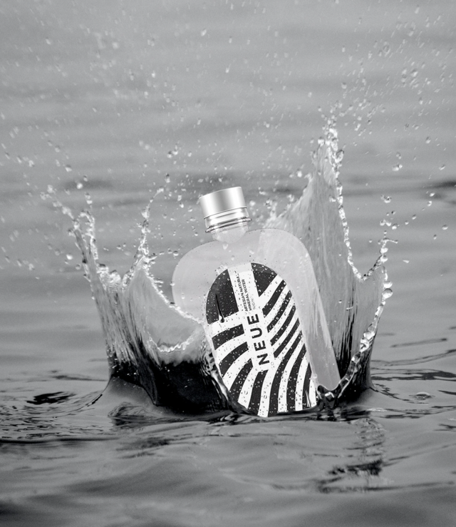 Bottled Water Splashing in Water. Bottle Splash Black and White. Bottle thrown in water to create splash. NEUE Water